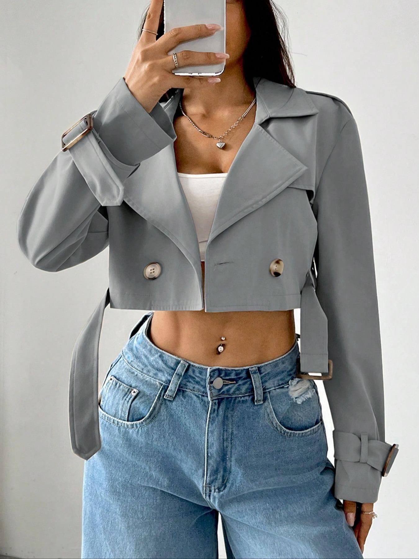 Gray cropped double-breasted trench coat with belt and adjustable cuffs.