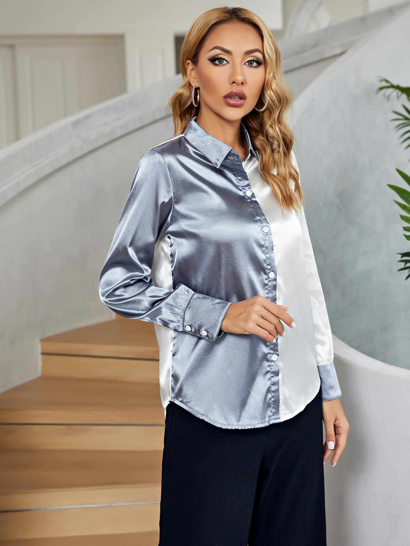 Satin colorblock button-down blouse in light blue and white with button cuffs.