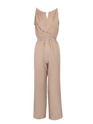 Beige halter neck wide leg jumpsuit with wrap waist detail and drawstring.