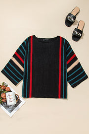Black knit pullover with red, tan, and teal stripe details on sleeves and sides.