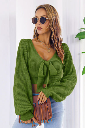 Green acrylic tie-front balloon sleeve crop knit sweater with V-neck.