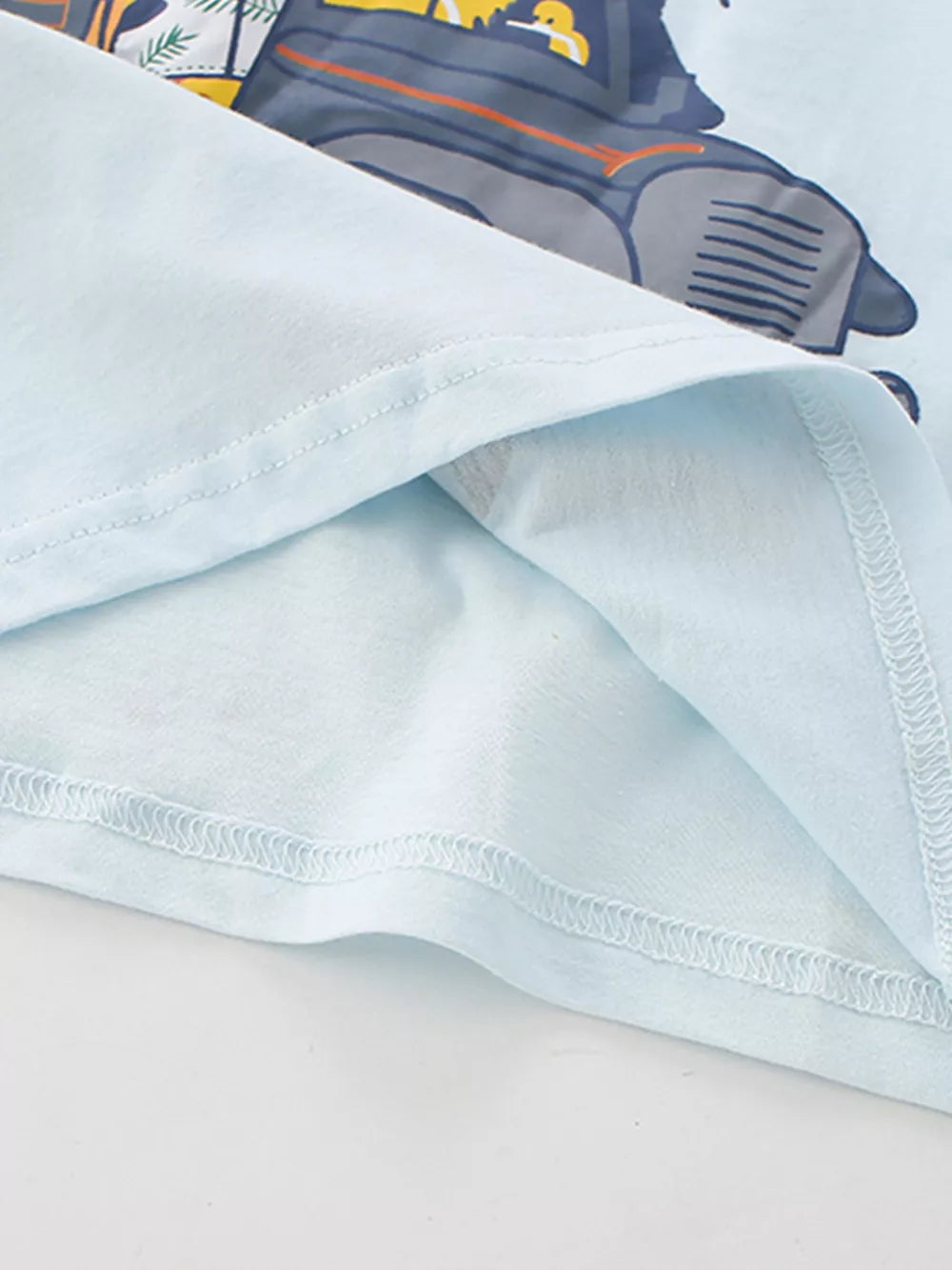 Light blue cotton baby tee with safari vehicle graphic detail.