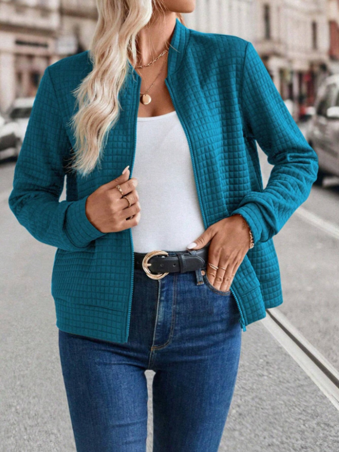 Quilted bomber jacket in French Blue with zip closure and stand-up collar.