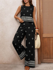 Black sleeveless geometric print top and wide-leg pants set with embroidered details.