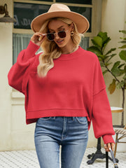 Red acrylic dropped shoulder knit sweater with balloon sleeves and crew neck.