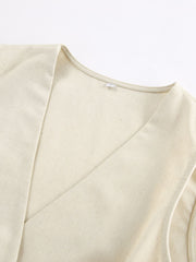 Cream cotton buttoned vest with V-neckline detail