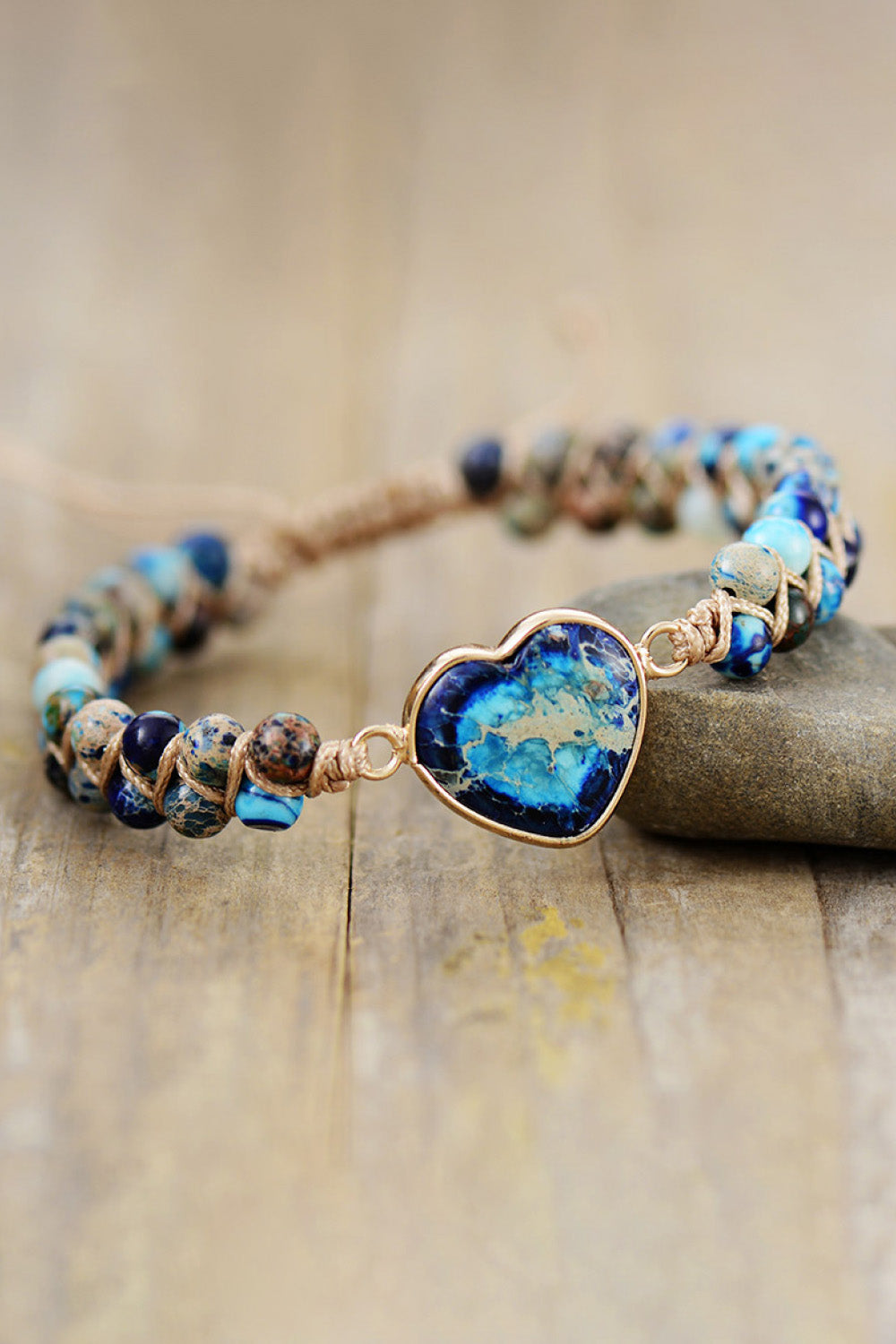 Braided bracelet with blue heart stone and mixed blue beads
