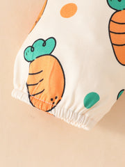 Baby set with cream fabric, orange carrot print, and elasticated cuffs.