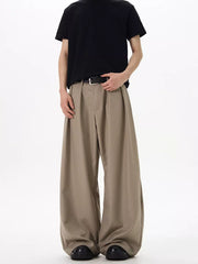 Men's khaki relaxed fit sweatpants with pleats and a wide leg.