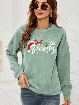 Sage corduroy crewneck sweatshirt with Christmas graphic and long sleeves.