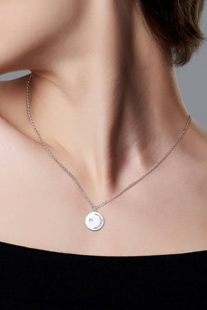 Silver moon and star pendant necklace with pave crystals on a delicate chain