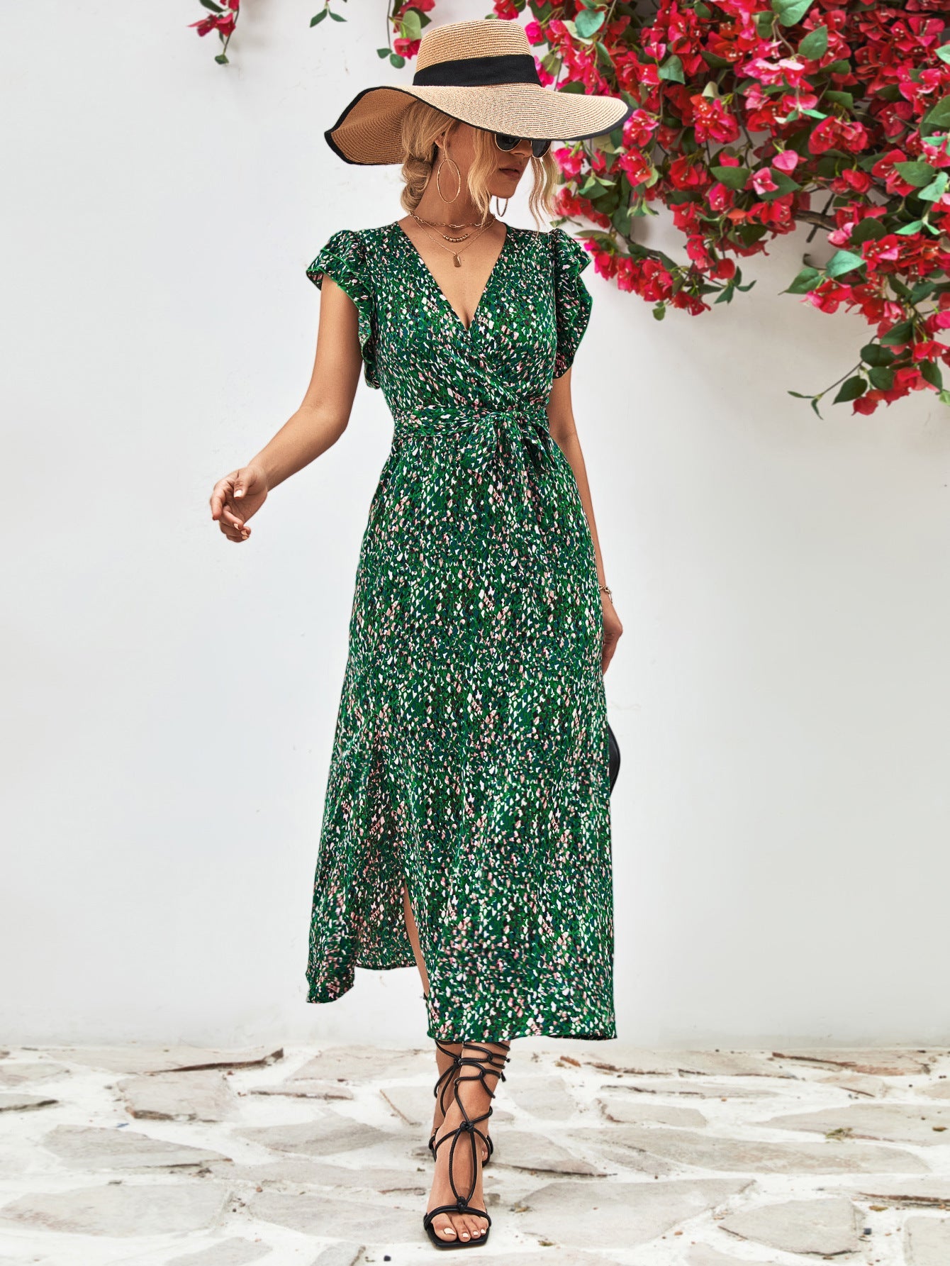 Green floral wrap midi dress with flutter sleeves and belted waist