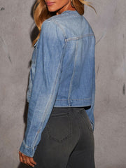 Light wash denim utility jacket with band collar and cargo pocket detail.