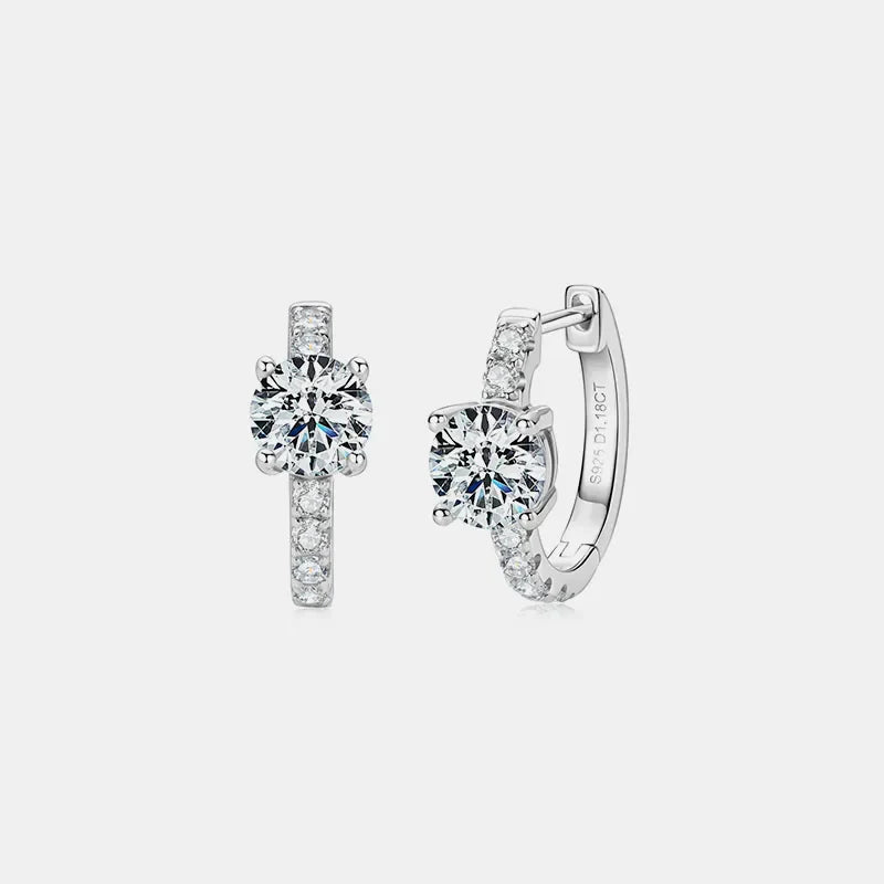 Silver pavé-set moissanite huggie hoop earrings with round-cut center stones.