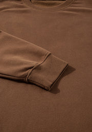 Relaxed fit loungewear set in coffee brown, showing ribbed cuff detail.