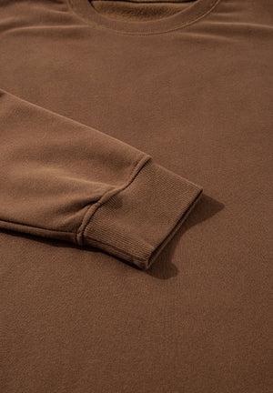 Relaxed fit loungewear set in coffee brown, showing ribbed cuff detail.