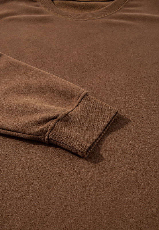 Relaxed fit loungewear set in coffee brown, showing ribbed cuff detail.