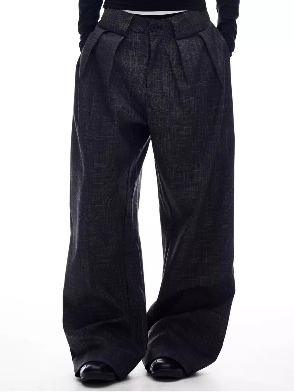 Men's dark grey wide-leg trousers with pleats and a subtle textured pattern.