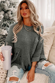 Distressed knit sweater in dark gray with a relaxed fit and cuffed sleeves.