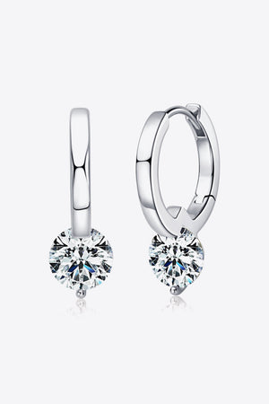 Silver solitaire gemstone huggie hoop earrings with a single round-cut clear stone.