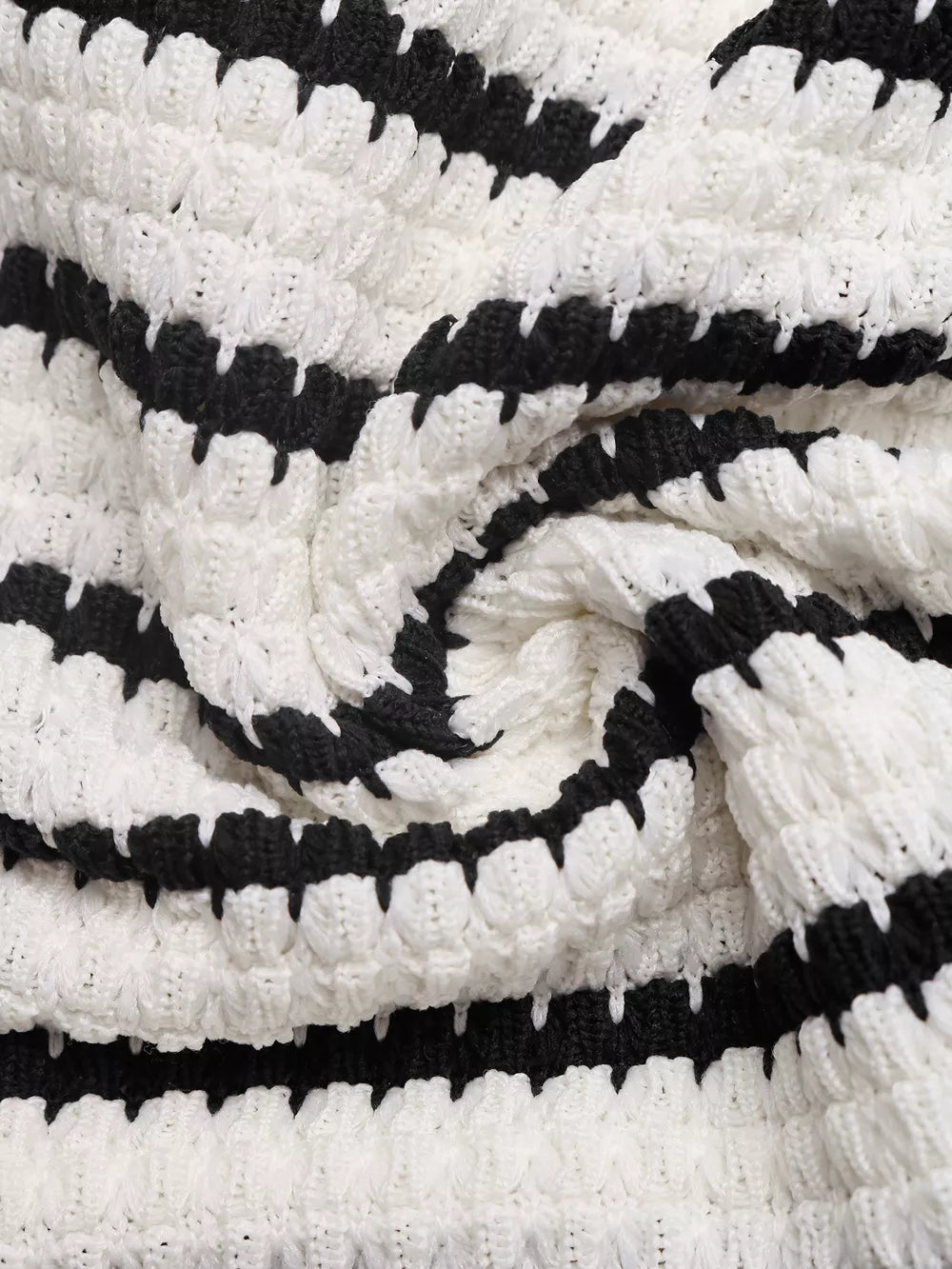 Chic Cutout Knit Mini Dress in black and white stripe pattern, textured knit fabric.