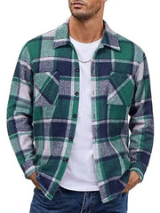 Men's green plaid button-up shirt with pockets, cotton blend, worn open over a white tee.