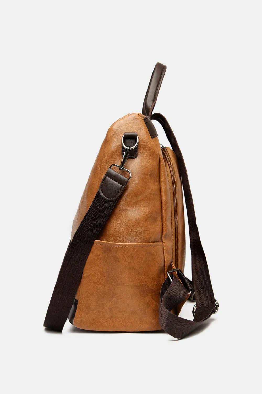 Caramel leather convertible backpack with adjustable strap and top handle.