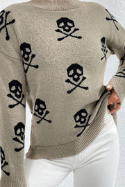 Khaki acrylic knit mock neck sweater with allover black skull and crossbones motif.