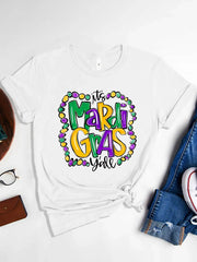 White graphic t-shirt with Mardi Gras beads and text design.