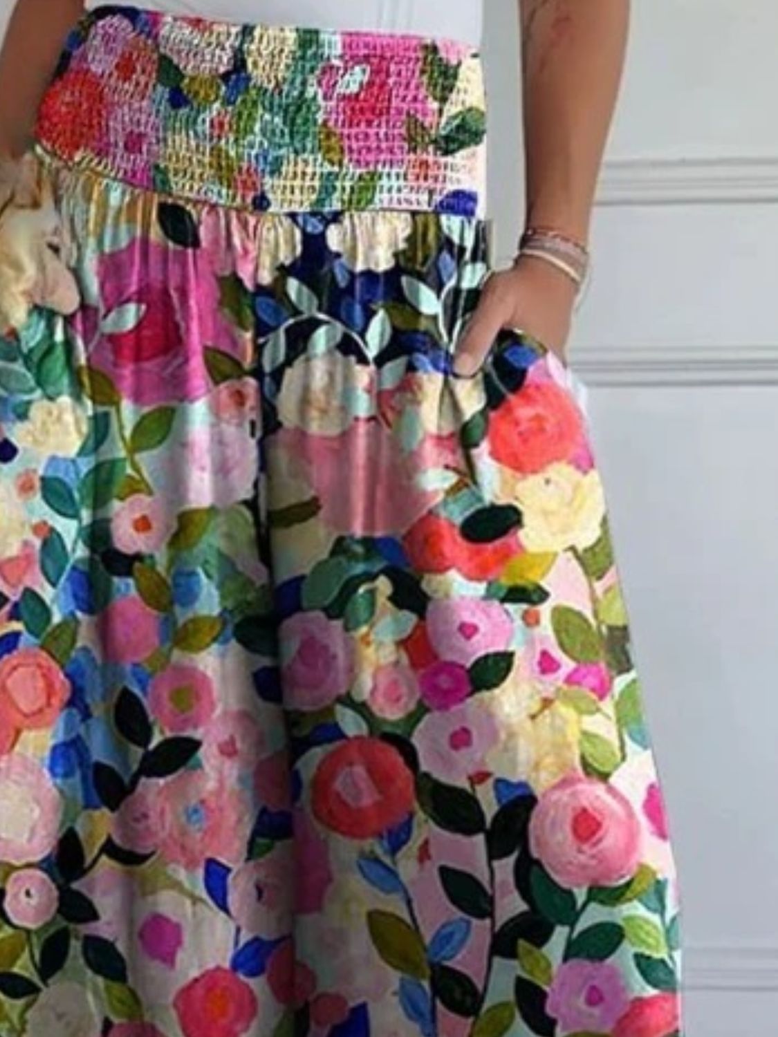 Smocked waistline floral flow trousers with pockets.