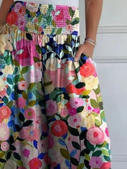 Smocked waistline floral flow trousers with pockets.