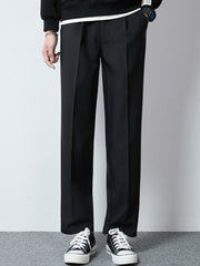Men's black wide-leg casual pants with a relaxed fit and pleats.