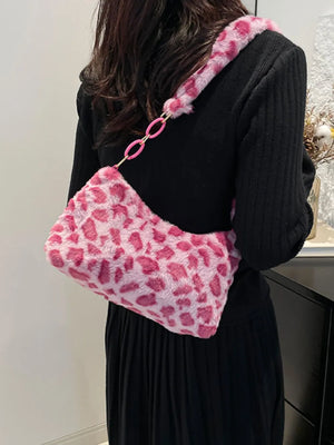 Fuchsia pink leopard print faux fur shoulder bag with chain detail.