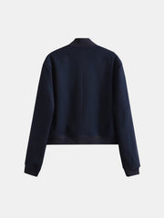 Indigo bomber jacket with ribbed collar, cuffs, and hem.