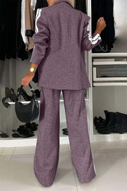Mauve track stripe blazer and wide leg trouser set with white stripe detail on sleeves and pant legs.
