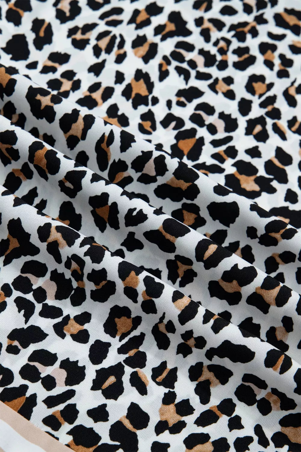 Leopard print midi dress with a colorblock detail.
