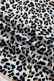 Leopard print midi dress with a colorblock detail.