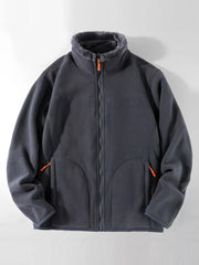 Dark gray fleece lined full zip sweatshirt with faux fur collar and orange zipper pull details.