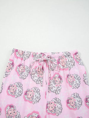 Pink pajama pants with a festive Santa Claus print and drawstring waist.