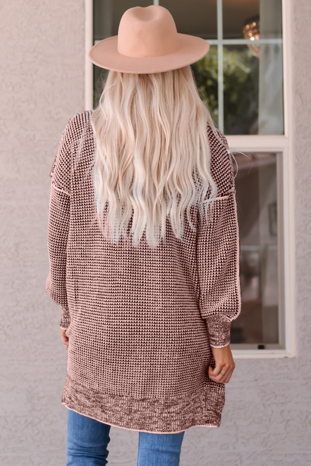 Pink textured puff sleeve open cardigan with a patterned knit and balloon sleeves.