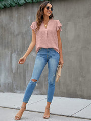 Dusty pink textured voile blouse with flutter sleeves and v-neck, styled with jeans.