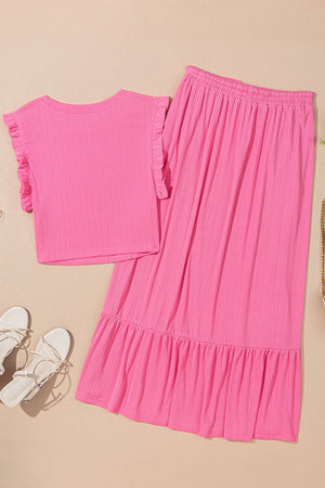 Pink ribbed co-ord skirt set with ruffled cap sleeves and tiered ruffled hem skirt.