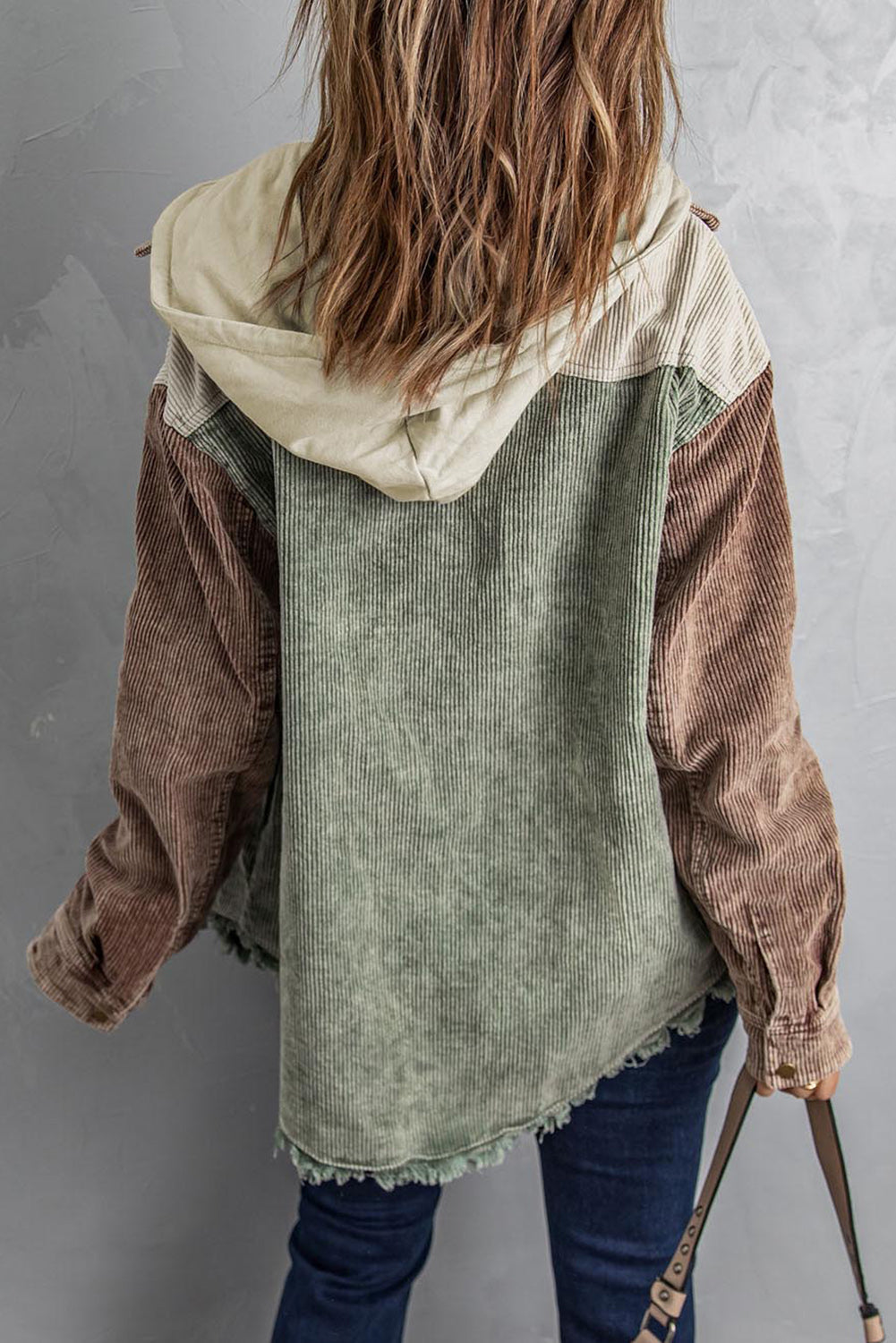 Colorblock corduroy hooded utility jacket in tan, sage, and brown with frayed hem.