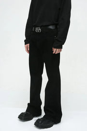 Dark denim bootcut trousers with a classic fit and a black belt.