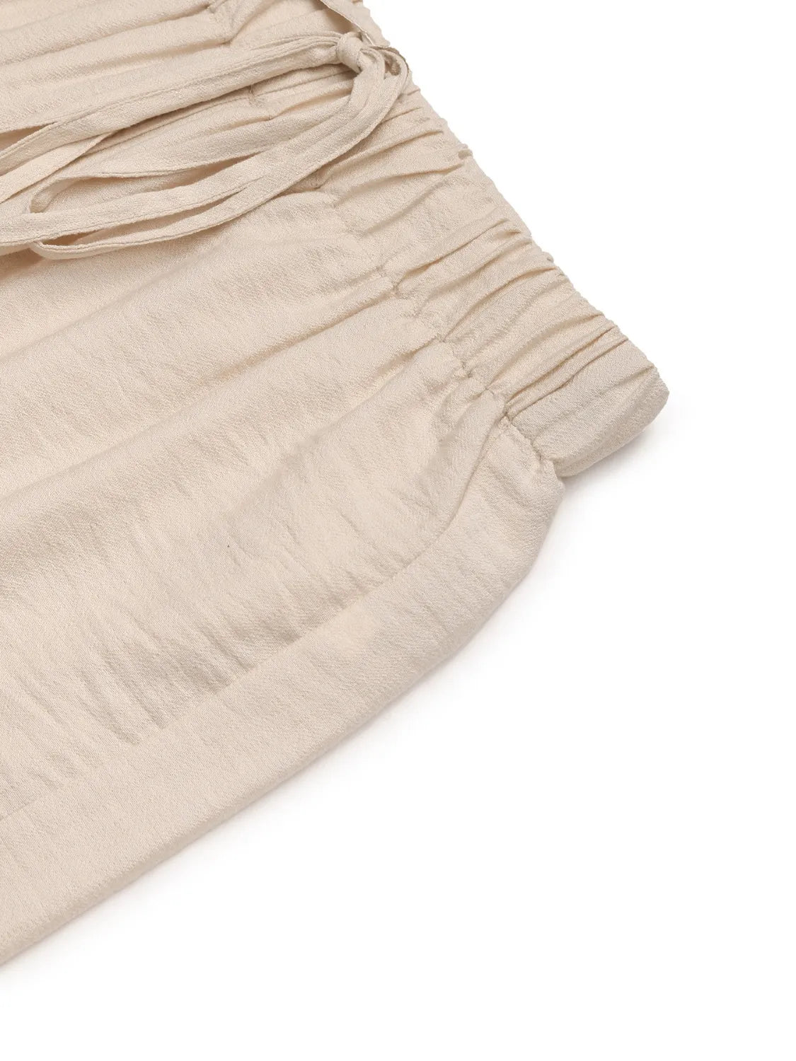 Chic tan waist-tie flare trousers with elasticated waistband and drawstring detail.