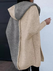 Two-tone hooded knit cardigan in camel and gray acrylic with side slits.