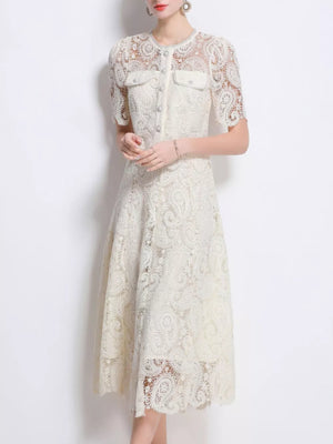 Cream lace buttoned dress with short sleeves and two chest pockets.