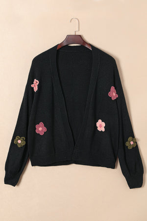Black knit cardigan with embroidered flowers on sleeves and front