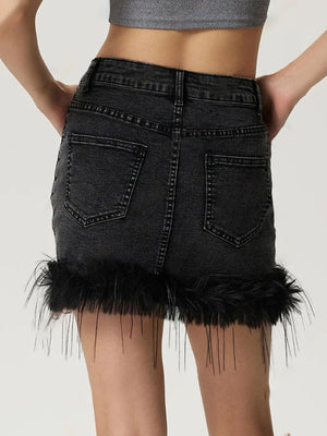 Black denim mini skirt with feather trim hem