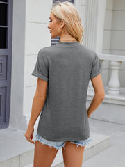 Dark Gray Henley shirt with rolled cuff sleeves and a button-down front, styled with denim shorts.